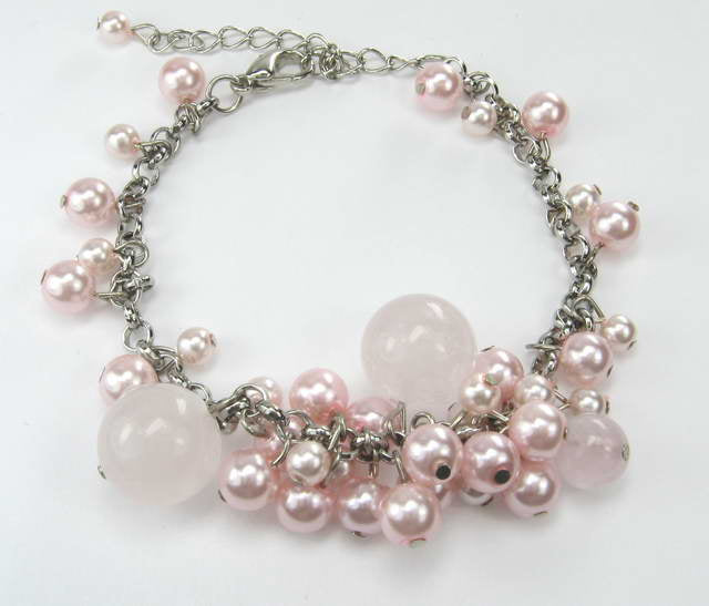 Elegant pink bead and crystal bracelet, perfect for enhancing any outfit with style and sophistication.