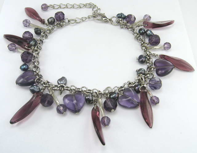 Elegant purple bead and crystal bracelet, blending vibrant color and sophistication for any occasion.