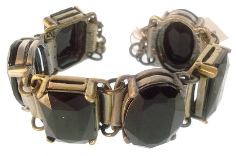 2-tone black bracelet featuring old silver and gold plating, adorned with jet stones, adjustable length, chic accessory.