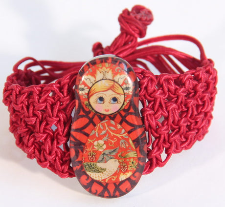 Vibrant red resin Babushka bracelet featuring intricate patterns for a bold, stylish accessory. Perfect for any occasion.