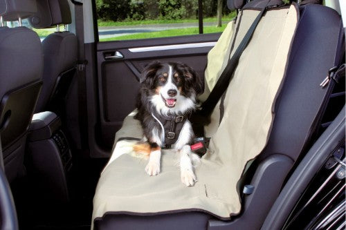 Beige Trixie dog car seat cover, 1.4x1.2M, protects seats from dirt, allows secure dog buckling, and features a zip for passenger use.