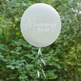 Botanical-themed baby shower balloon with vibrant patterns and a decorative tail, perfect for celebrating motherhood.