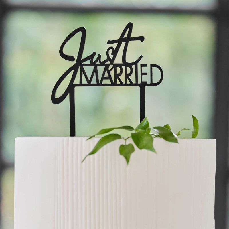 Contemporary black acrylic "Just Married" cake topper, 16.5cm high, adds elegance to any wedding cake design.