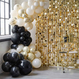 Elegant Champagne Noir Balloon Arch with black, nude, and gold balloons, perfect for celebrations and photo backdrops.