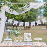 White and green botanical bunting with 12 flags, perfect for christening celebrations and other special occasions.