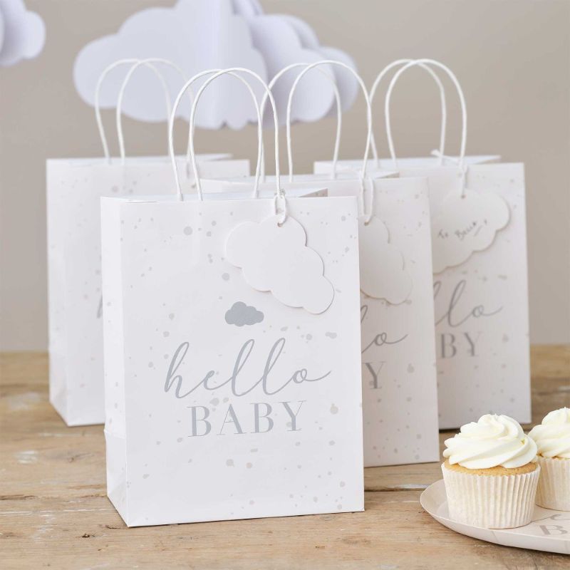 Adorable speckle and cloud baby shower gift bags, eco-friendly, with personalized name tags, perfect for any celebration.