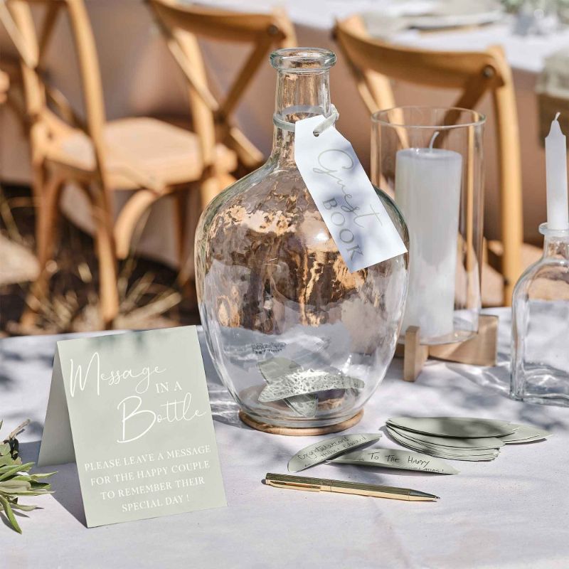 Elegant sage glass vase guest book with 60 paper leaves for heartfelt messages, perfect for eco-conscious weddings.