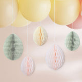 Colorful honeycomb Easter eggs in cream, light pink, and sage green for festive spring decor and easy hanging.