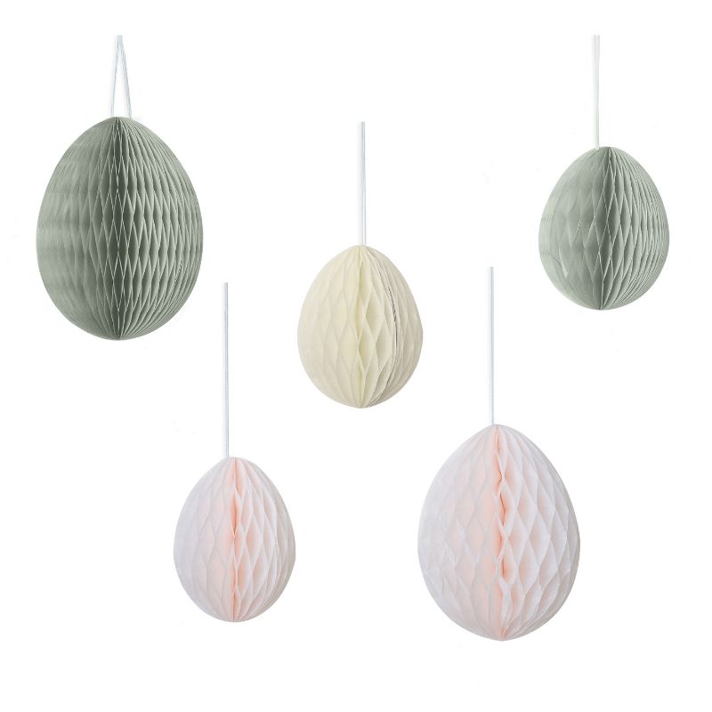 Colorful honeycomb Easter egg decorations in cream, light pink, and sage, perfect for festive hanging displays.