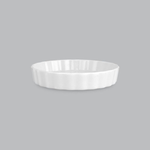 Elegant 12.5 x 2cm quiche dish in durable new bone porcelain, oven, microwave, and dishwasher safe for versatile baking.