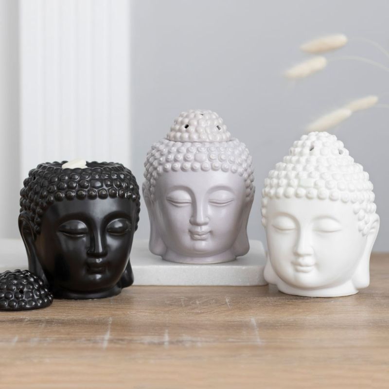 Matte black ceramic Buddha head oil burner for aromatherapy, measuring 14x9x9 cm, enhances relaxation and decor.