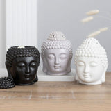 Matte black ceramic Buddha head oil burner for aromatherapy, measuring 14x9x9 cm, enhances relaxation and decor.