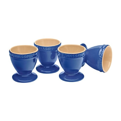 Set of 4 elegant blue stoneware egg cups, perfect for serving soft or hard-boiled eggs at breakfast.