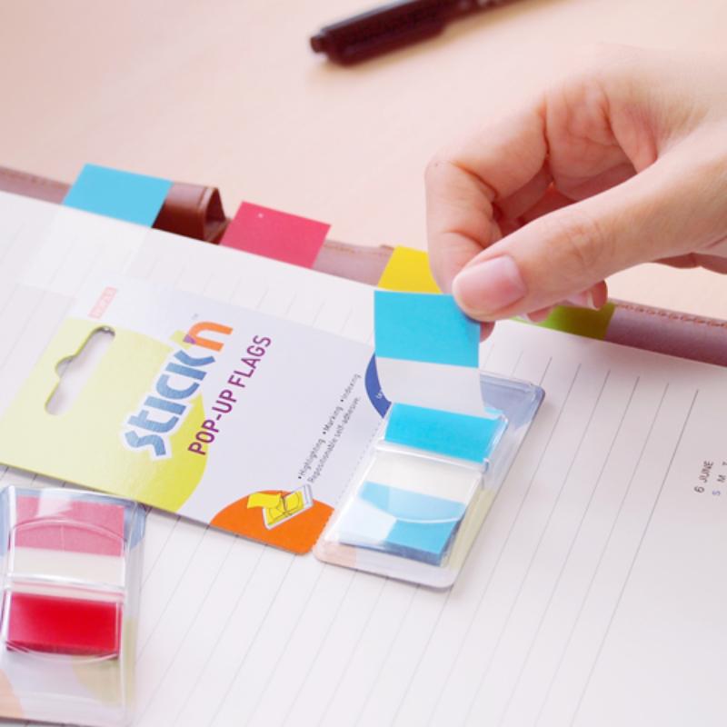 Vibrant yellow Stick'n Pop Up Flags in a pack of 50, ideal for organizing notes and marking important documents.