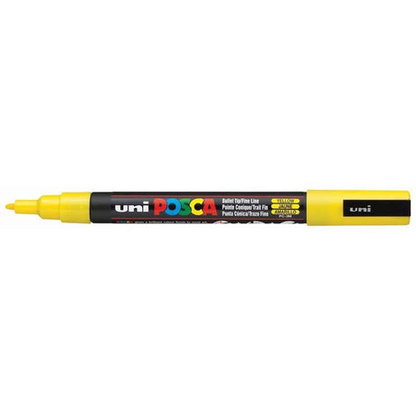 Vibrant yellow Uni Posca paint marker with fine 0.9-1.3mm tip, ideal for detailed artwork on various surfaces.