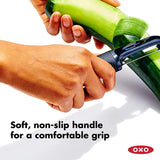 OXO Good Grips Swivel Peeler with twin stainless steel blades and non-slip handle for easy and efficient peeling of tough-skinned produce.