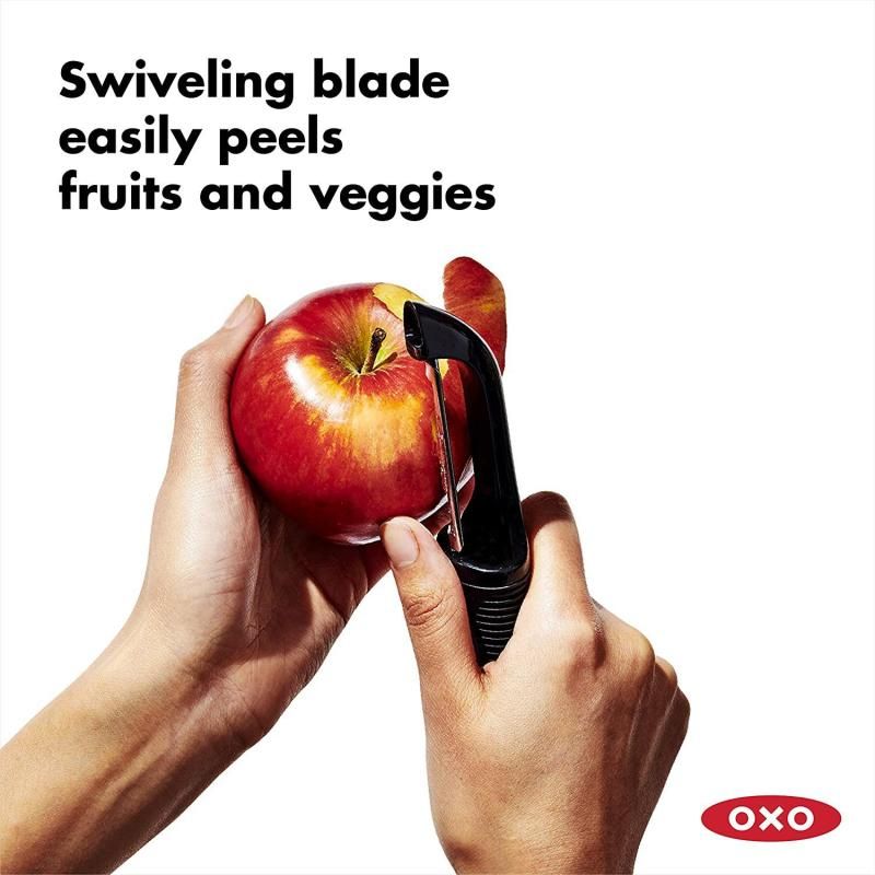 OXO Good Grips Swivel Peeler with twin stainless steel blades, non-slip handle, and built-in eye remover for easy vegetable peeling.