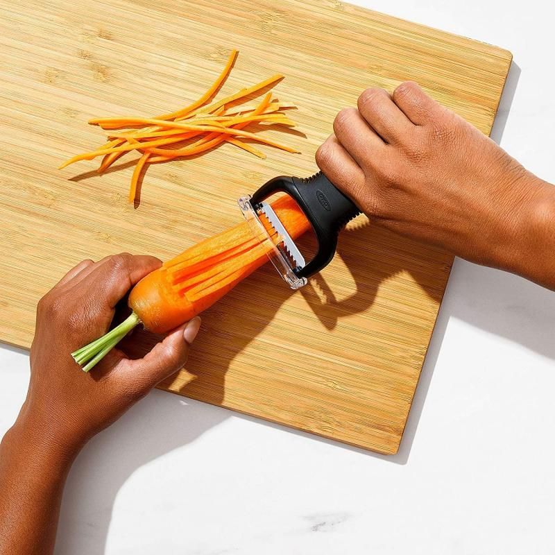 Julienne peeler creating precise vegetable strips, featuring a comfortable non-slip handle and compact Y-shaped design.