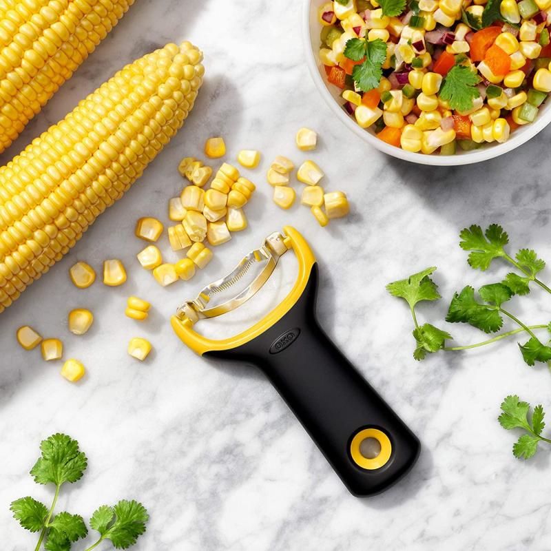 Efficient OXO Good Grips Corn Prep Peeler with ergonomic handle and rustproof blade for easy corn kernel removal.