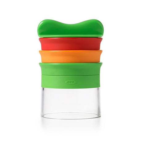 Hand-held spiralizer with three blades for creating vegetable noodles; features a non-slip grip and food holder for safe use.