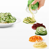 Hand-held spiralizer with three interchangeable blades for creating healthy vegetable noodles like zucchini and potato spirals.