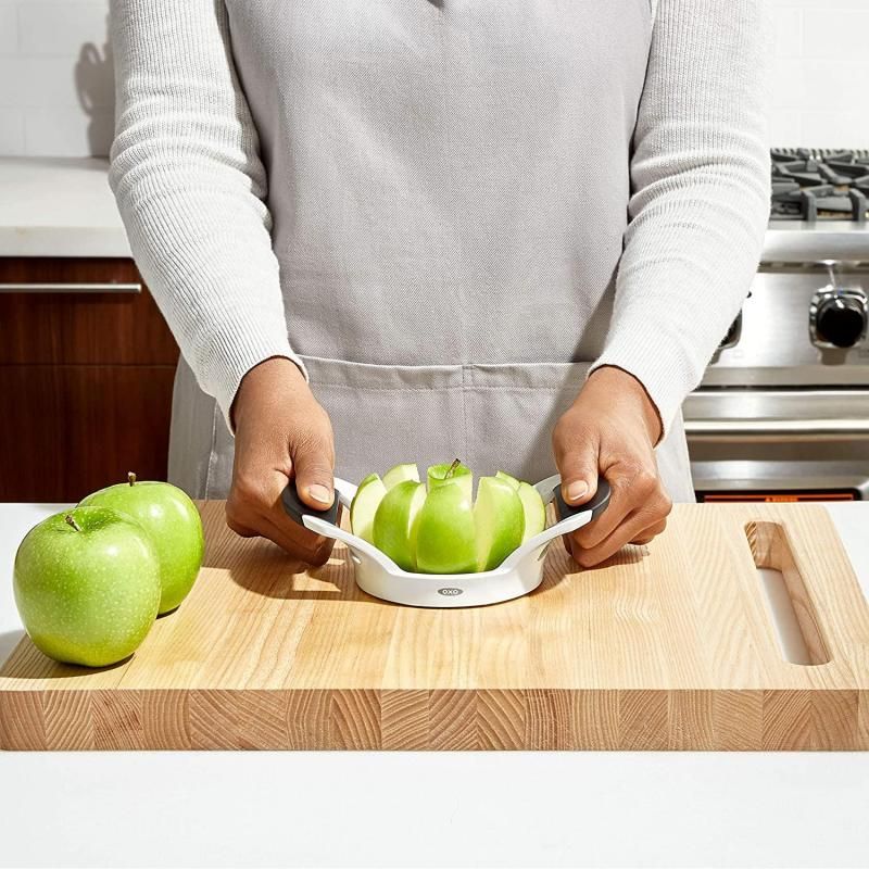 Stainless steel apple divider with soft handles for easy slicing and coring, perfect for pies and snacks.