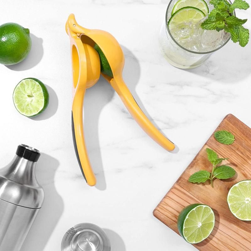 Sleek OXO Good Grips Citrus Squeezer with non-slip handles for easy lemon and lime juicing, dishwasher safe for easy cleanup.