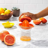 OXO Good Grips 2-In-1 Citrus Juicer with interchangeable reamers, drip-free spout, and easy measurement markings.