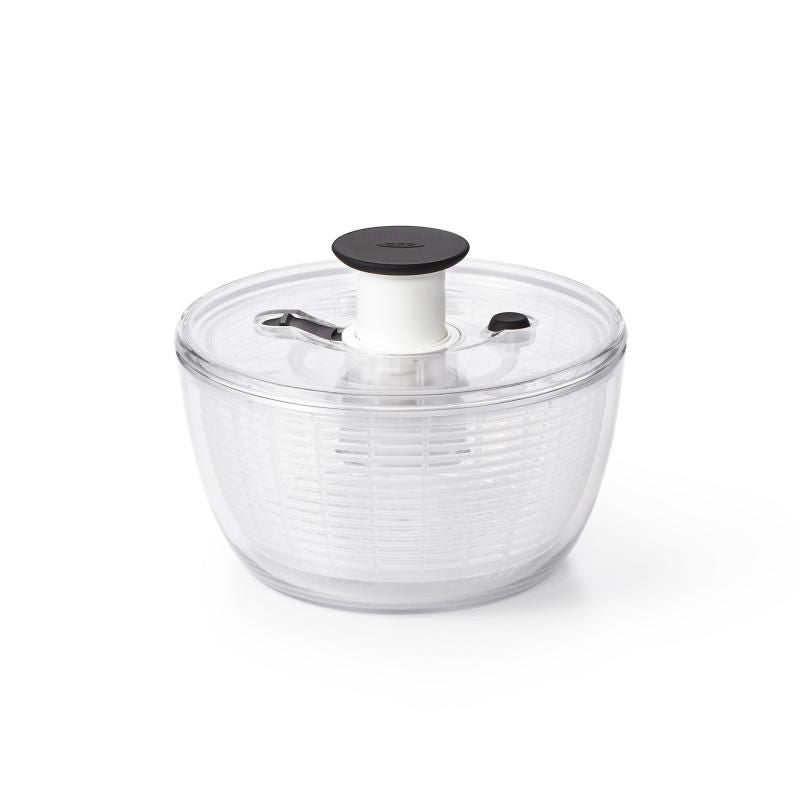 Compact salad spinner with one-handed pump mechanism, BPA-free materials, and non-slip base for easy greens drying.