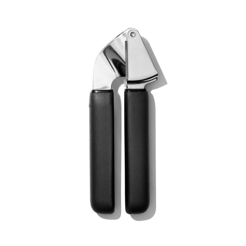 OXO Good Grips Garlic Press with ergonomic handles, stainless steel design, and large hopper for easy garlic crushing.