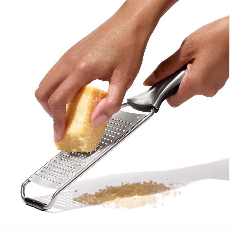 OXO Steel Medium Grater with sharp stainless steel teeth and ergonomic handle for effortless grating of cheese and vegetables.