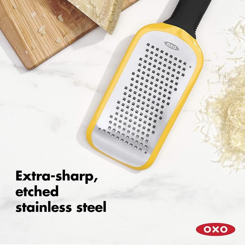 Image of OXO Good Grips Etched Medium Grater featuring sharp etched stainless steel surface, non-slip feet, and soft grip handle.