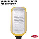 OXO Good Grips Etched Medium Grater featuring a sharp stainless steel surface, non-slip feet, and a soft-grip handle for easy use.