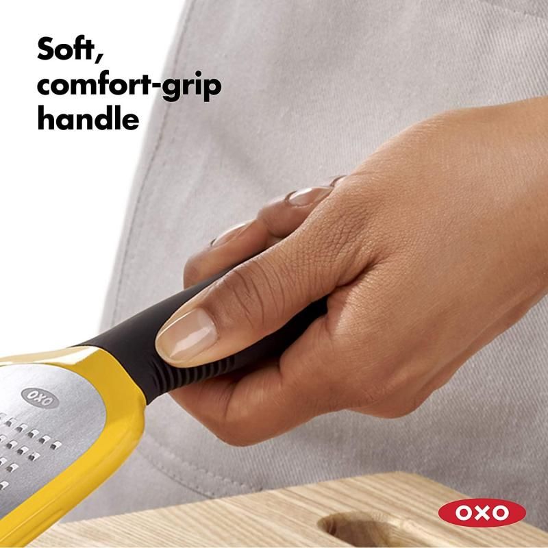 OXO Good Grips Etched Medium Grater with stainless steel surface, non-slip feet, and soft grip handle for effortless grating.