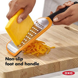 Etched coarse grater with ergonomic non-slip handle, perfect for grating cheese, vegetables, and fruits with ease.