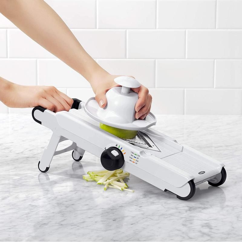 OXO Good Grips V-Blade Mandoline Slicer with adjustable thickness and V-shaped blade for versatile, effortless slicing.