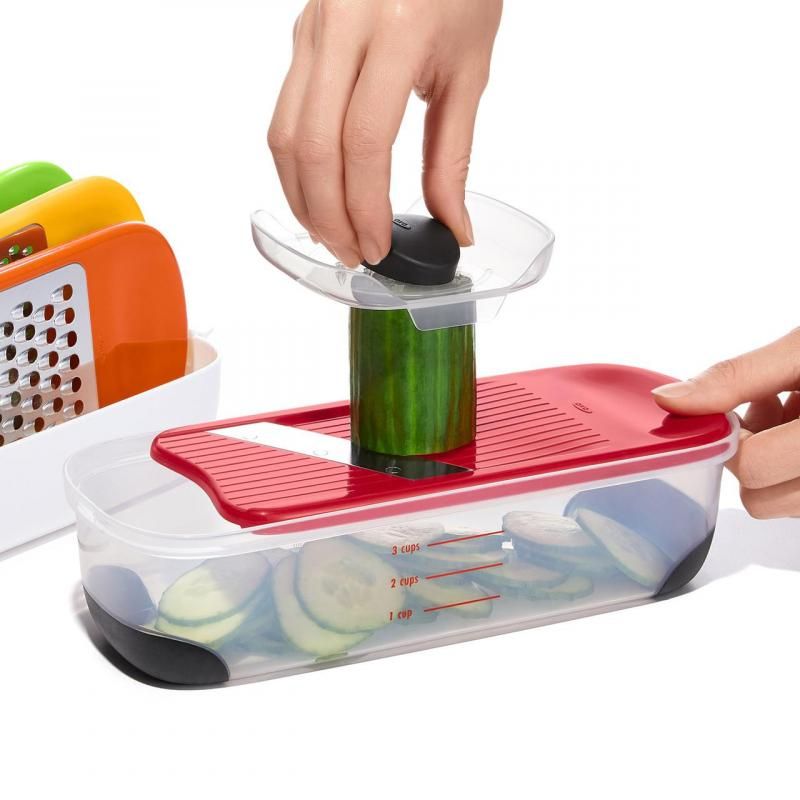 OXO Good Grips Complete Grate & Slicer Set with four interchangeable surfaces for grating and slicing, featuring comfort grip and safety holder.