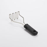 OXO Good Grips Wire Potato Masher with stainless steel head and cushioned handle for smooth, fluffy mashed potatoes.