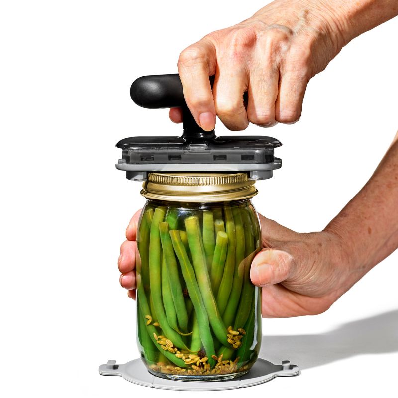 Image of OXO Good Grips Twisting Jar Opener with Base Pad, designed for easy jar opening with ergonomic grip and non-slip base.