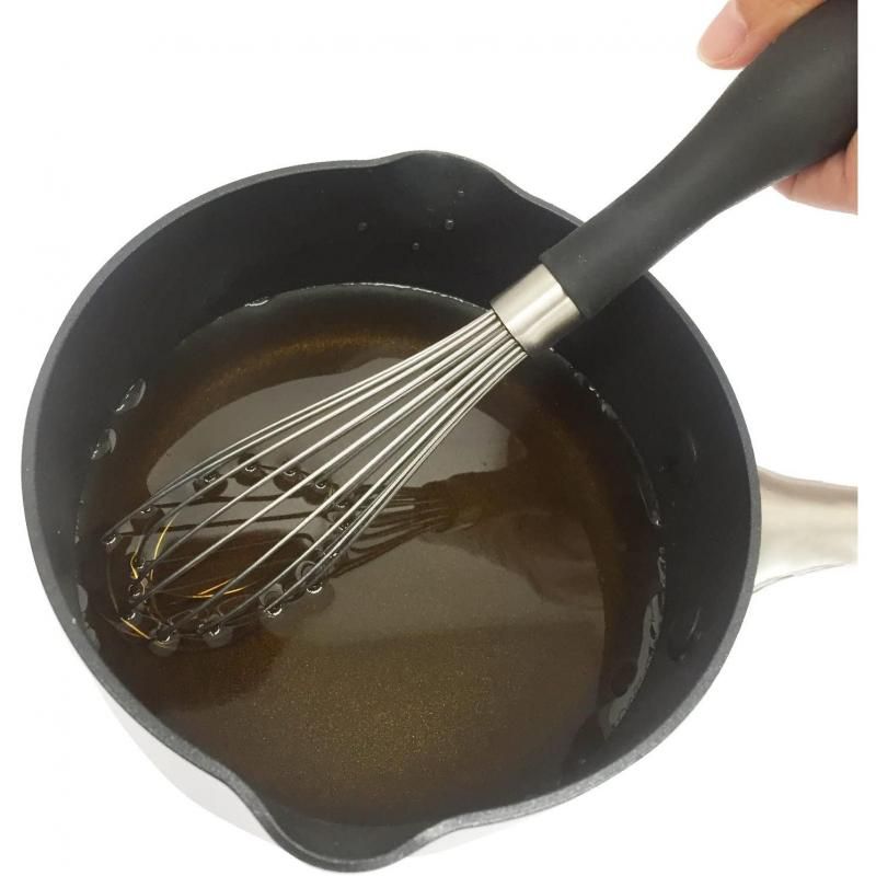 OXO Good Grip 9-inch whisk with ergonomic handle, stainless steel wires, perfect for whipping and mixing in small containers.