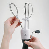 OXO Good Grips Egg Beater Whisk features smooth gears, removable stainless steel beaters, and a non-slip handle for easy mixing.