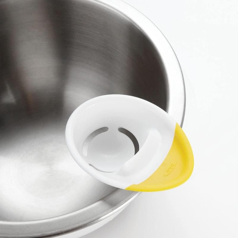 Innovative OXO 3-IN-1 Egg Separator with adjustable ridges for mess-free egg cracking and yolk separation.