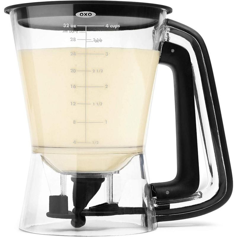 Clear batter dispenser with easy-to-squeeze handle, measurement markings, and removable valve for precise, mess-free pouring.