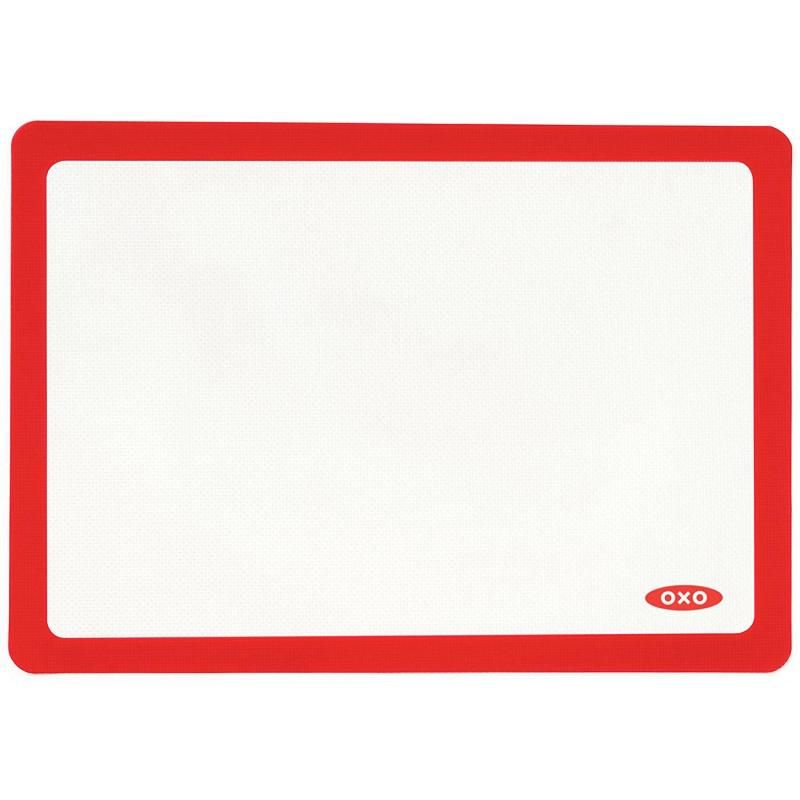 OXO Good Grips Silicone Baking Mat in White, non-stick, reusable, fits half-sheet pans, oven-safe up to 450°F.