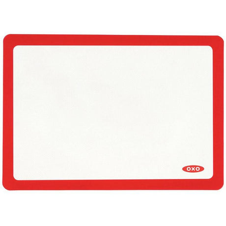 OXO Good Grips Silicone Baking Mat in White, non-stick, reusable, fits half-sheet pans, oven-safe up to 450°F.