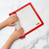 OXO Good Grips Silicone Baking Mat in white, reusable, non-stick, perfect for cookies and roasting, fits half-sheet pans.