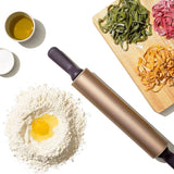 Non-stick rolling pin with contoured handles, perfect for baking pastries and cookie dough, 12-inch durable steel design.