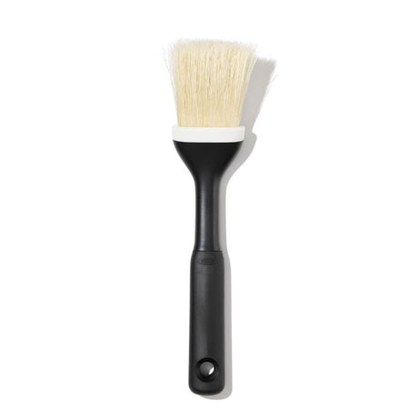 Natural boar bristle pastry brush with angled head, soft grip handle, perfect for basting and egg washes; dishwasher safe.