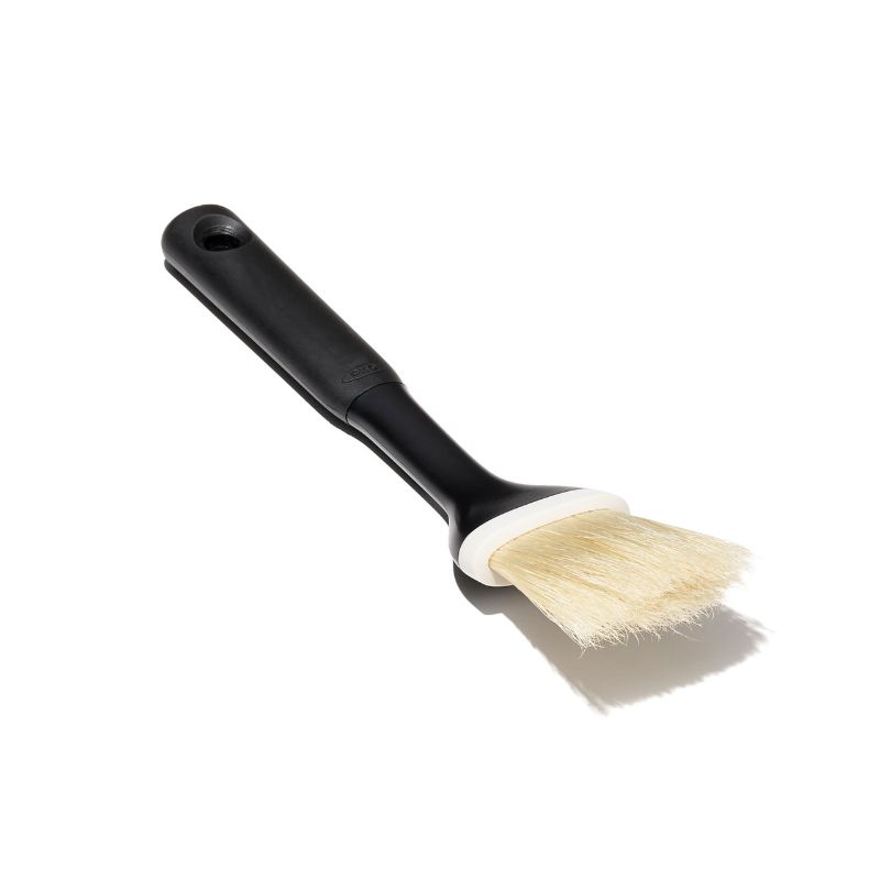 Natural boar bristle pastry brush with angled head, soft non-slip handle; ideal for basting and easy to clean.