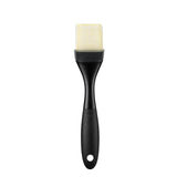 Silicone pastry brush with layered bristles for sauces and glazes, heat-resistant, ergonomic, and dishwasher safe.